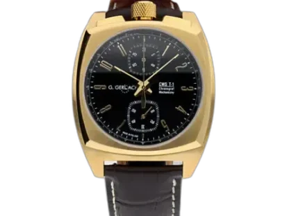 Zegarek męski G. Gerlach CWS T-1 Gold Black z czarną tarczą i złotą kopertą o kanciastym, nowoczesnym kształcie. Tarcza wyposażona w złote cyfry arabskie oraz wskazówki, co harmonizuje z elegancką, złotą kopertą. Na tarczy znajdują się trzy subtarcze z funkcjami chronografu, rozmieszczone na godzinie 12, 6 i 9. Nad tarczą widnieje logo "G. Gerlach" oraz oznaczenie modelu "CWS T-1 Chronograf Mechaniczny". Koronka z teksturowanym wykończeniem w złotym kolorze umiejscowiona jest na górze koperty. Zegarek posiada brązowy, skórzany pasek z eleganckim przeszyciem.