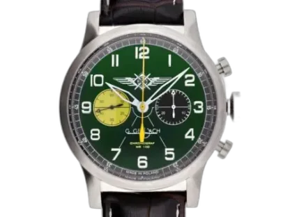 Zegarek męski G. Gerlach Pilot Chronograf Zielony z wyjątkową zieloną tarczą o klasycznym lotniczym designie. Tarcza ozdobiona jest białymi arabskimi cyframi oraz kontrastowymi srebrnymi wskazówkami, które gwarantują doskonałą czytelność. Chronograf posiada dwie sub-tarcze – jedna w kolorze żółtym, druga czarna, co nadaje sportowego i dynamicznego charakteru. Centralnie umieszczone logo lotnicze podkreśla prestiż oraz nawiązuje do historycznych modeli lotniczych. Srebrna koperta ze stali nierdzewnej perfekcyjnie komponuje się z czarnym, skórzanym paskiem o eleganckim wykończeniu.